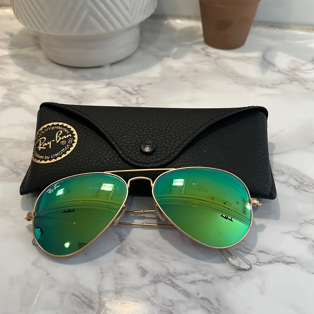 Ray-Ban women’s Green lenses with gold trim.